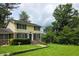 Charming two-story home with brick accents, a well-manicured lawn, and mature trees at 529 Valley Woods Se Cir, Conyers, GA 30094