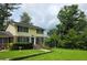 Charming two-story home with brick accents, a well-manicured lawn, and mature trees at 529 Valley Woods Se Cir, Conyers, GA 30094