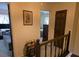 Hallway with wood railing leads to bedrooms and living areas at 529 Valley Woods Se Cir, Conyers, GA 30094