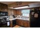 Traditional kitchen with wood cabinets and plenty of counter space at 529 Valley Woods Se Cir, Conyers, GA 30094