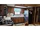Traditional kitchen featuring wood cabinetry and laminate countertops at 529 Valley Woods Se Cir, Conyers, GA 30094