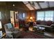 Cozy living room with wood paneling and a classic furniture set at 529 Valley Woods Se Cir, Conyers, GA 30094