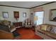 Bright living room features orange carpet, comfortable seating, and vintage decor at 529 Valley Woods Se Cir, Conyers, GA 30094