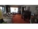 Cozy living room featuring orange carpet, vintage furniture, and abundant natural light at 529 Valley Woods Se Cir, Conyers, GA 30094