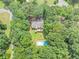 Home with a spacious backyard, private deck, mature trees and swimming pool at 250 Daileys Plantation Dr, Mcdonough, GA 30253