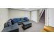 Finished basement with a large sectional sofa, neutral colors, and storage at 250 Daileys Plantation Dr, Mcdonough, GA 30253