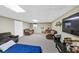 Finished basement includes large lounging area, with carpeted floors, and ample lighting at 250 Daileys Plantation Dr, Mcdonough, GA 30253