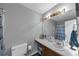 Well-lit bathroom featuring a sleek vanity, and ample storage space at 250 Daileys Plantation Dr, Mcdonough, GA 30253