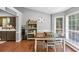 Cozy dining area with a bay window, hardwood floors, and modern decor at 250 Daileys Plantation Dr, Mcdonough, GA 30253