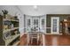 Sunlit dining room boasting hardwood floors and windows providing scenic backyard views at 250 Daileys Plantation Dr, Mcdonough, GA 30253