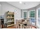 Inviting dining area featuring a wood table, and a decor shelf, perfect for Gathering meals and entertaining at 250 Daileys Plantation Dr, Mcdonough, GA 30253
