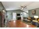 Bright living room featuring hardwood floors, vaulted ceiling and brick fireplace at 250 Daileys Plantation Dr, Mcdonough, GA 30253