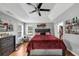 This main bedroom features a trey ceiling, natural light, and laminate floors at 250 Daileys Plantation Dr, Mcdonough, GA 30253