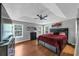 This main bedroom features a trey ceiling, natural light, and laminate floors at 250 Daileys Plantation Dr, Mcdonough, GA 30253