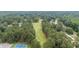 Overhead image of the golf course with lush greenery and neighborhood at 705 Clubhouse Se Dr, Conyers, GA 30094