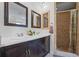 Modern bathroom featuring a double vanity and a beautifully tiled shower at 705 Clubhouse Se Dr, Conyers, GA 30094