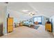 Spacious bedroom with blue walls, matching furnishings, and a ceiling fan at 705 Clubhouse Se Dr, Conyers, GA 30094