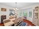 Bright dining area with hardwood floors, chair rail, and built-in display case at 705 Clubhouse Se Dr, Conyers, GA 30094