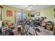Multi-purpose exercise room featuring an array of workout equipment and natural light at 705 Clubhouse Se Dr, Conyers, GA 30094