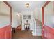 Foyer with brick flooring, stairs, and a view into other rooms in the home at 705 Clubhouse Se Dr, Conyers, GA 30094