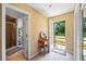Well-lit hallway leads to an outdoor deck and full bathroom at 705 Clubhouse Se Dr, Conyers, GA 30094