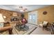 Inviting living room with a brick fireplace, plush seating, area rug, and decorative lighting at 705 Clubhouse Se Dr, Conyers, GA 30094