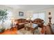 Comfortable living room with hardwood floors, neutral walls, and natural light streaming through the windows at 705 Clubhouse Se Dr, Conyers, GA 30094