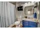 Cozy bathroom with blue vanity, sink, and modern fixtures, offering a blend of comfort and style at 1753 Liberty Pkwy, Atlanta, GA 30318