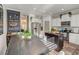 Bright kitchen features an island, stainless appliances, and a dining area with a wine rack at 1753 Liberty Pkwy, Atlanta, GA 30318