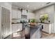 Well-equipped kitchen with white cabinets, stainless appliances, and an island with black countertop at 1753 Liberty Pkwy, Atlanta, GA 30318