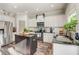 Bright kitchen with stainless appliances, dark island with granite countertops, and a subway tile backsplash at 1753 Liberty Pkwy, Atlanta, GA 30318