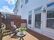 Relaxing back porch with patio furniture and a door leading into the home at 4107 Township Pkwy # 69, Sandy Springs, GA 30342