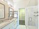 Bathroom with double vanity, walk-in shower, and a view of the walk-in closet at 4107 Township Pkwy # 69, Sandy Springs, GA 30342