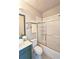 Well-lit bathroom features a shower-tub combo with sliding glass doors and a vanity at 4107 Township Pkwy # 69, Sandy Springs, GA 30342