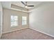 Bright, spacious bedroom with a tray ceiling, modern ceiling fan, and plenty of natural light at 4107 Township Pkwy # 69, Sandy Springs, GA 30342
