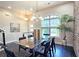 Open dining space with a modern chandelier, large window, and stylish decor at 4107 Township Pkwy # 69, Sandy Springs, GA 30342