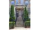 Close-up of the front entrance showcasing brick steps and black railings leading to modern doors at 4107 Township Pkwy # 69, Sandy Springs, GA 30342