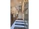 Inviting entryway with hardwood floors, staircase, and modern cable railings at 4107 Township Pkwy # 69, Sandy Springs, GA 30342