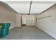 Spacious two-car garage with epoxy flooring, overhead storage, and access door at 4107 Township Pkwy # 69, Sandy Springs, GA 30342