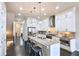 Bright kitchen features an island, stainless steel appliances, stone countertops, and dark hardwood floors at 4107 Township Pkwy # 69, Sandy Springs, GA 30342