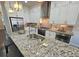 Kitchen island features a stainless steel sink with granite countertops and modern stainless steel appliances at 4107 Township Pkwy # 69, Sandy Springs, GA 30342