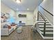 Comfortable living area with seating, stairs and stylish décor at 4107 Township Pkwy # 69, Sandy Springs, GA 30342