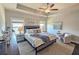 Comfortable main bedroom featuring a tray ceiling, large windows, stylish decorations, and carpet at 4107 Township Pkwy # 69, Sandy Springs, GA 30342