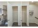 Double door pantry features wire shelving for lots of storage space at 4107 Township Pkwy # 69, Sandy Springs, GA 30342