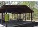 Community pavilion with picnic tables offers a great gathering space in a wooded area at 4107 Township Pkwy # 69, Sandy Springs, GA 30342
