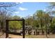 A playground featuring play structures and swings, surrounded by lush landscaping at 4107 Township Pkwy # 69, Sandy Springs, GA 30342