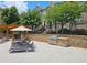 Poolside lounge area with outdoor grill and manicured landscaping at 4107 Township Pkwy # 69, Sandy Springs, GA 30342