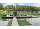 Covered boat dock on the lake with boat, jet ski lifts, and plenty of room for lake toys at 6900 Driskell Cir, Cumming, GA 30041