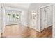 Hallway nook with wood floors and window that streams natural light into the area at 6900 Driskell Cir, Cumming, GA 30041