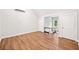 Bonus room with wood floors, lots of natural light and modern ceiling-mounted air conditioning unit at 6900 Driskell Cir, Cumming, GA 30041